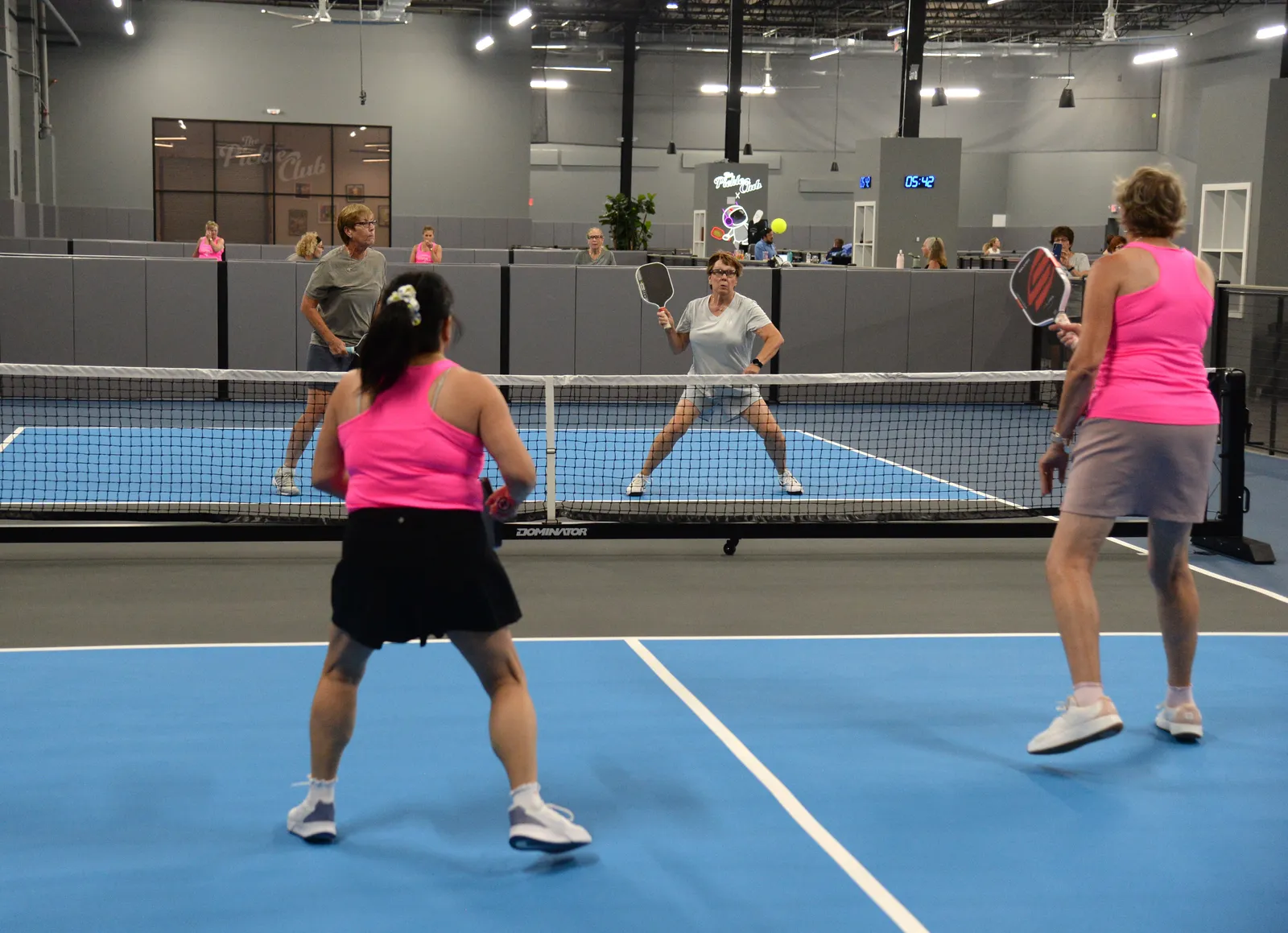 Players on the pickleball courts at The Pickle Club Syosset